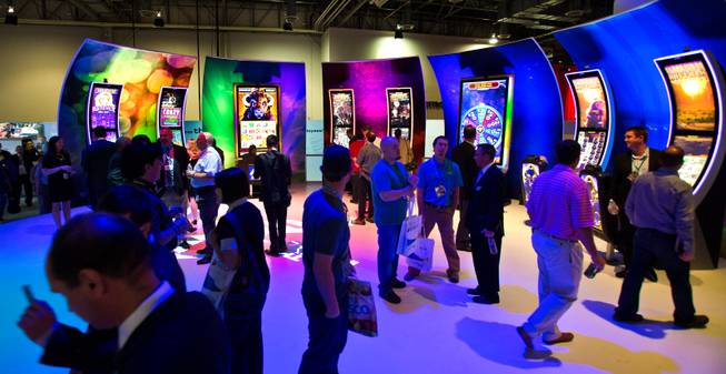 Attendees take in some of the new stylish machines during the Global Gaming Expo (G2E), the gaming industry's big annual convention taking place at the Sands Expo onTuesday, September 30, 2014.