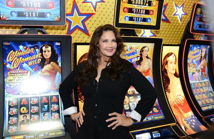 Lynda Carter appears at the 2014 Global Gaming Expo in Las Vegas on Tuesday, Sept. 30, 2014, to unveil two "Wonder Woman" slot machines.