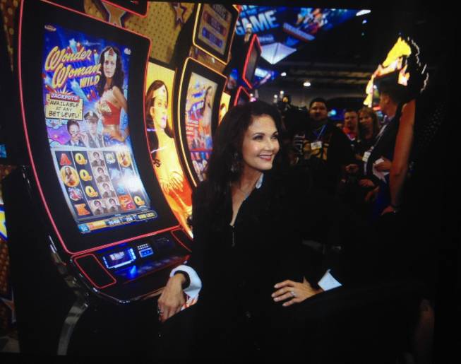 Lynda Carter appears at the 2014 Global Gaming Expo in Las Vegas on Tuesday, Sept. 30, 2014, to unveil two "Wonder Woman" slot machines.