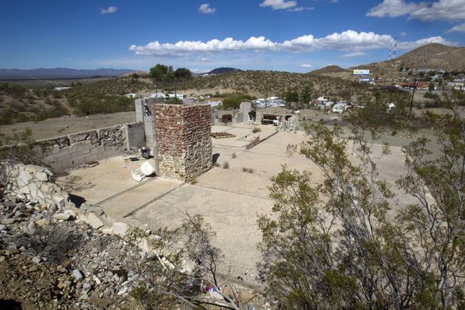 An abandoned, partially-built house behind the bunkhouse is shown in Searchlight, Nev. Sunday Sept. 28, 2014. STEVE MARCUS