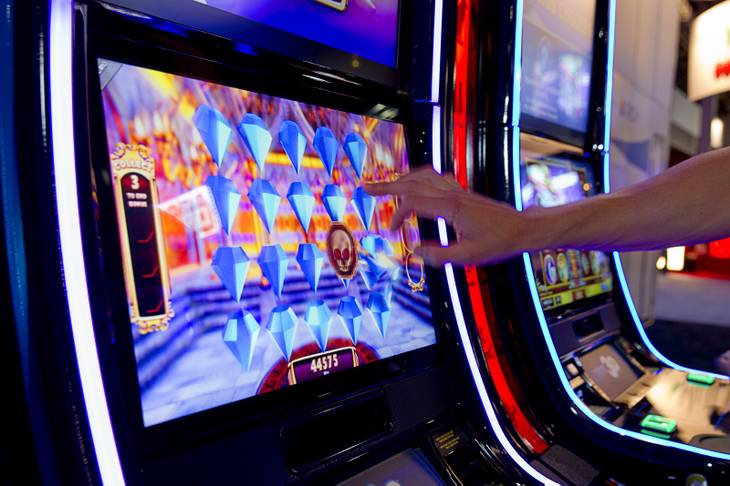 A player picks jewels in a bonus level on a GTECH Bejeweled True 3D slot machine during the final day of the Global Gaming Expo (G2E) at the Sands Expo Center Thursday, Oct. 2, 2014.
