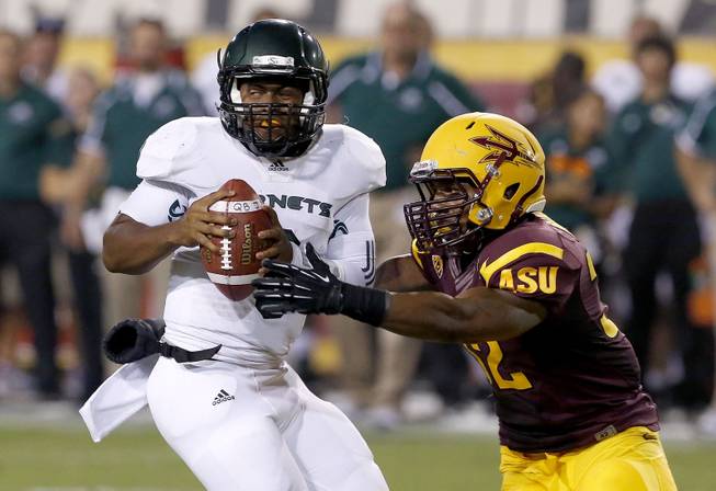 Sacramento State's Jihad Vercher, left, gets sacked by Arizona State 's Antonio Longino, right, during the second half in an NCAA college football game on Thursday, Sept. 5, 2013, in Tempe, Ariz.  Arizona State defeated Sacramento State 55-0. (AP Photo/Ross D. Franklin)