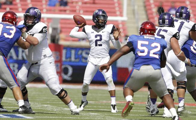 TCU quarterback Trevone Boykin (2) passes during the second half of an NCAA college football game against SMU Saturday, Sept. 27, 2014, in Dallas. (AP Photo/LM Otero)