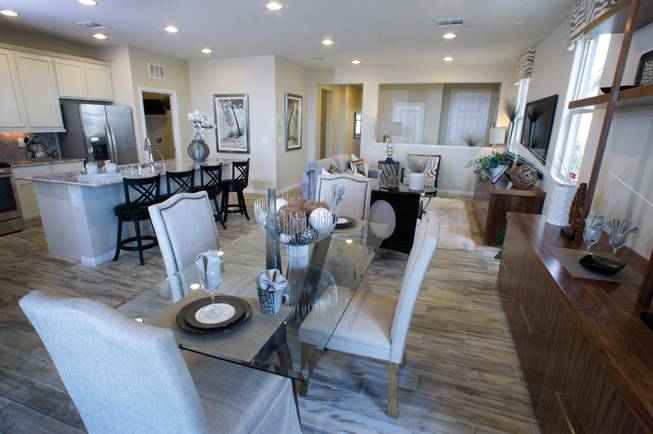 The great room (kitchen, living, dining) in a one-story plan 1849 model home at KB Homes' Tevare residential development in Summerlin on Wednesday, July 30, 2014. 