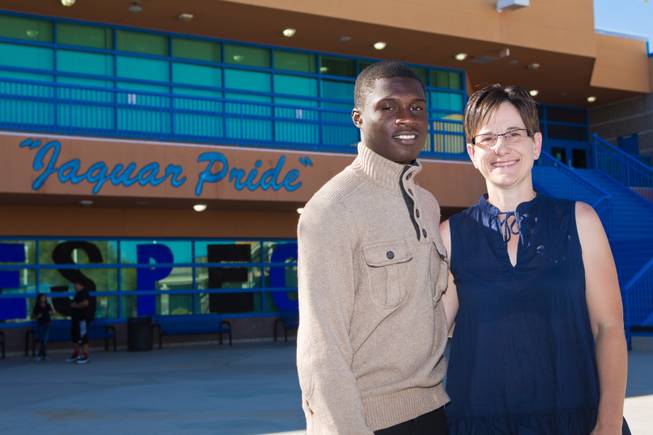 Gianni Breland, a student at Desert Pines High School, stands with his Mama Jaguar, Suzanne Strosser, a teacher at Desert Pines, on Thursday Oct. 2, 2014.