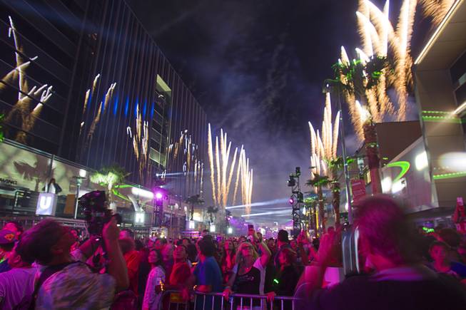 People photograph fireworks as Downtown Summerlin celebrates its grand opening Thursday, Oct. 9, 2014. 
