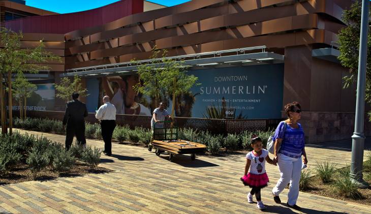Shoppers and workers make their way along the walkways during the Grand Opening of Downtown Summerlin on Thursday, October 9, 2014.
