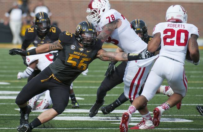 Missouri's Shane Ray, left, tries to tackler Indiana running back D'Angelo Roberts during the second quarter of an NCAA college football game Saturday, Sept. 20, 2014, in Columbia, Mo. (AP Photo/L.G. Patterson)