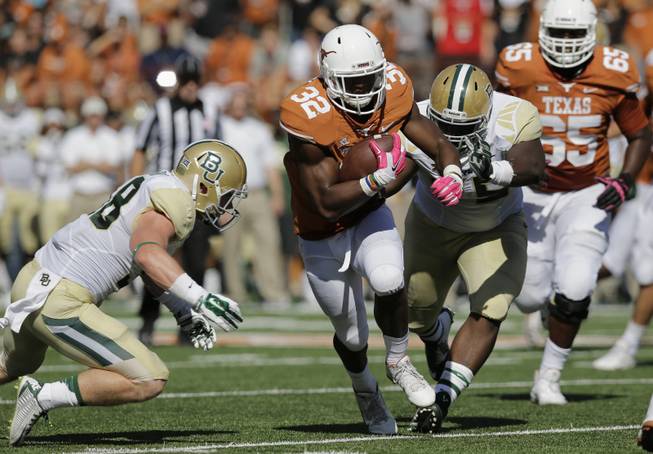 Texas' Johnathan Gray (32) runs against Baylor during the first half of an NCAA college football game, Saturday, Oct. 4, 2014, in Austin, Texas. (AP Photo/Eric Gay)