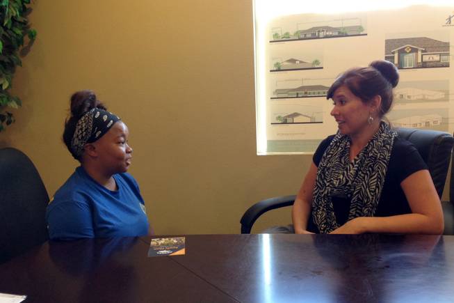 Brianna Grandberry, 18, left, talks with her case manager Shawna Freimanis at the Nevada Partnership for Homeless Youth on Wednesday, Oct. 8, 2014. Grandberry graduated from the homeless youth program last week.
