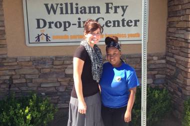 Nevada Partnership for Homeless Youth case manager Shawna Freimanis, left, stands with Brianna Grandberry, 18, outside the group’s Drop-in Center on Wednesday, Oct. 8, 2014. Grandberry recently graduated from the homeless youth program.
