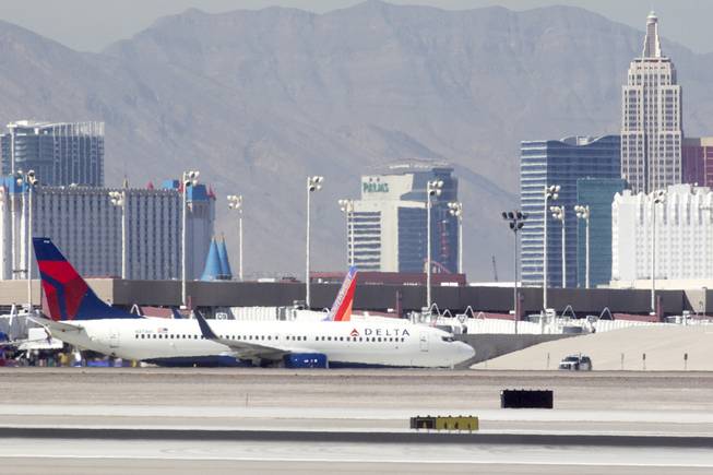 A Delta plane taxis on the runway at McCarran International Airport on October 10, 2014.