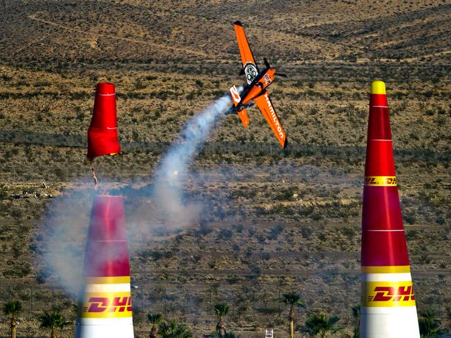 Master pilot Nicolas Ivanoff of France severs a pylon on the Red Bull Air Race course placing sixth in the qualifying round Saturday, Oct. 11, 2014, at Las Vegas Motor Speedway.