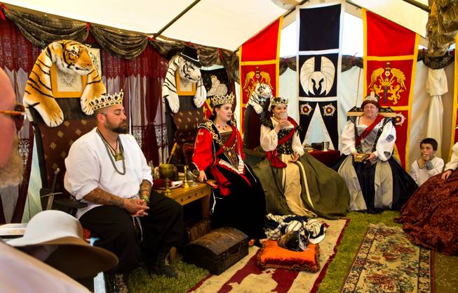 The Empire of Northumbria guild's royal party makes plans for the upcoming parade during the Renaissance Festival at Sunset Park on Saturday, October 11, 2014.