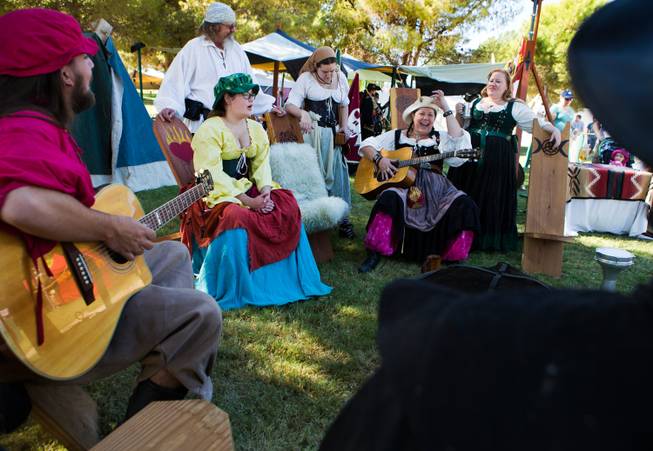 Members of the Dogs of War Guild create a little music as part of the Renaissance Festival at Sunset Park on Saturday, October 11, 2014.