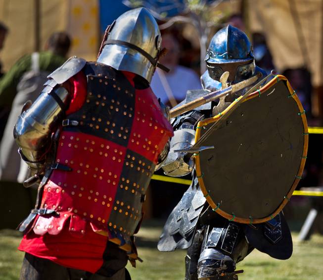 Knights in armor battle for demonstration during the Renaissance Festival at Sunset Park on Saturday, October 11, 2014. .