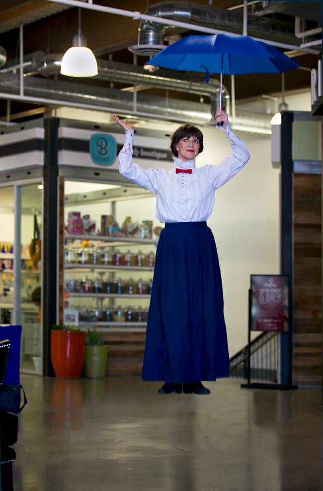 In an illustration a Mary Poppins character floats away after reading and singing to children at Tivoli Village on Thursday, October 9, 2014. Nannies and Housekeepers USA present the twice monthly "Story Time with Mary Poppins" program there. .