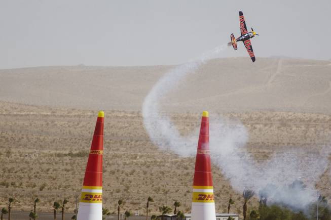 A plane races through the air on the second day at the Red Bull Air Race at the Las Vegas Motor Speedway on October 12, 2014.