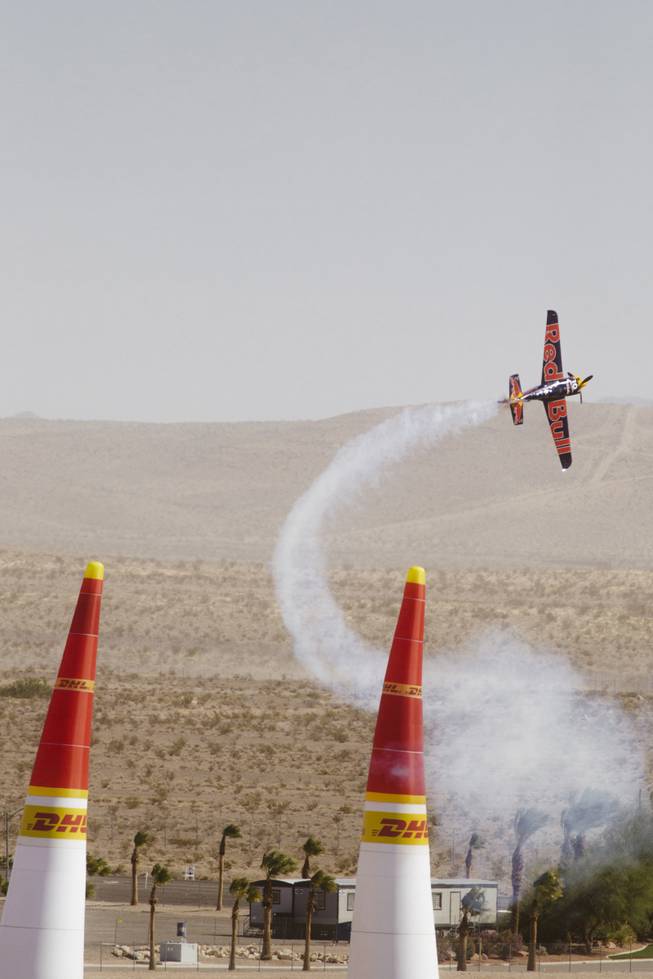 A plane races through the air on the second day at the Red Bull Air Race at the Las Vegas Motor Speedway on October 12, 2014.