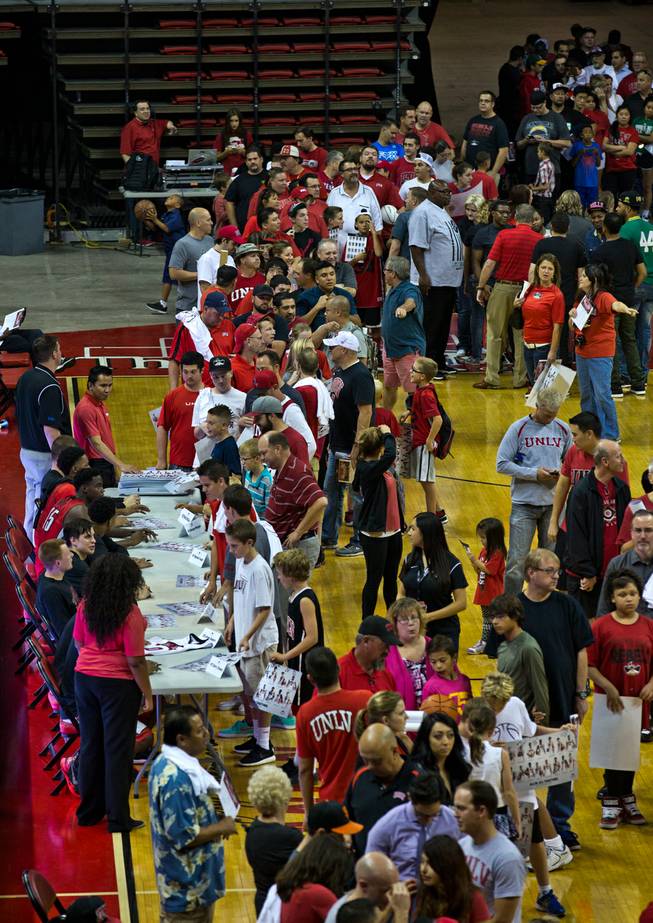 Fans line up about the court as UNLV basketball team players sign autographs following the scarlet and gray exhibition game at the Thomas & Mack Center on Thursday, October 16, 2014..
