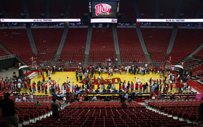 Fans line up about the court as UNLV basketball team players sign autographs following the scarlet and gray exhibition game at the Thomas & Mack Center on Thursday, October 16, 2014. .