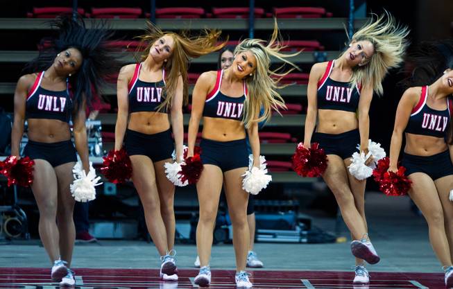 The UNLV cheerleaders perform for the crowd before the basketball team's Scarlet and Gray exhibition game at the Thomas & Mack Center on Thursday, Oct. 16, 2014.