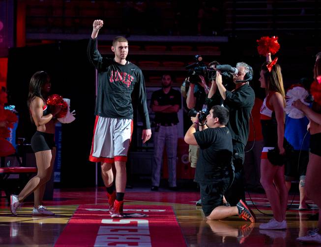 The UNLV basketball team's Ben Carter #13 walks onto the court as he's introduced for the scarlet and gray exhibition at the Thomas & Mack Center on Thursday, October 16, 2014.
