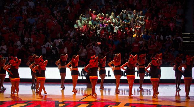UNLV cheerleaders fire up fans before the Rebels' Scarlet & Gray Showcase at the Thomas & Mack Center on Thursday, Oct. 16, 2014.