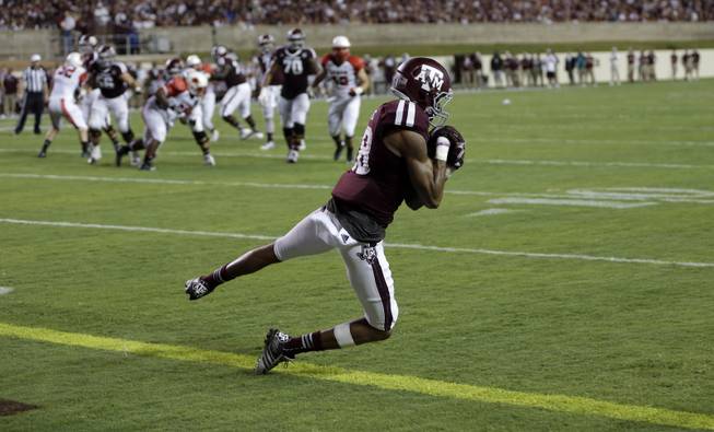 Texas A&M wide receiver Edward Pope (18) catches a pass for a touchdown against Lamar during the second quarter of an NCAA college football game Saturday, Sept. 6, 2014, in College Station, Texas. (AP Photo/David J. Phillip)