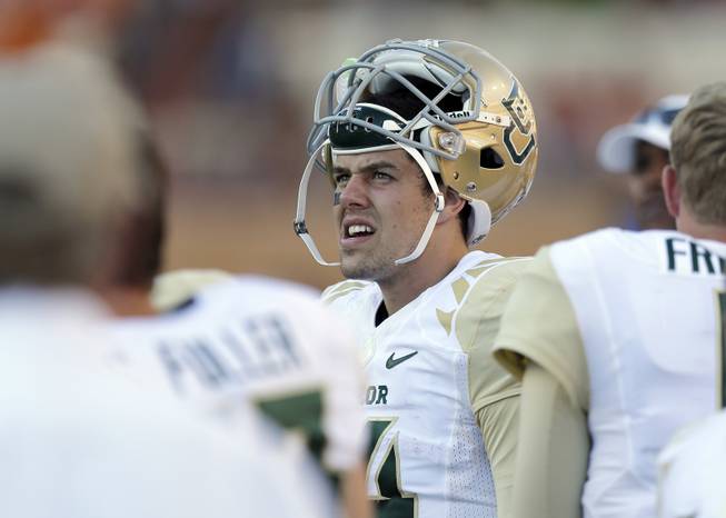 Baylor's Bryce Petty, center, stands on the sidelines during the second half of an NCAA college football game against Texas, Saturday, Oct. 4, 2014, in Austin, Texas. (AP Photo/Eric Gay)