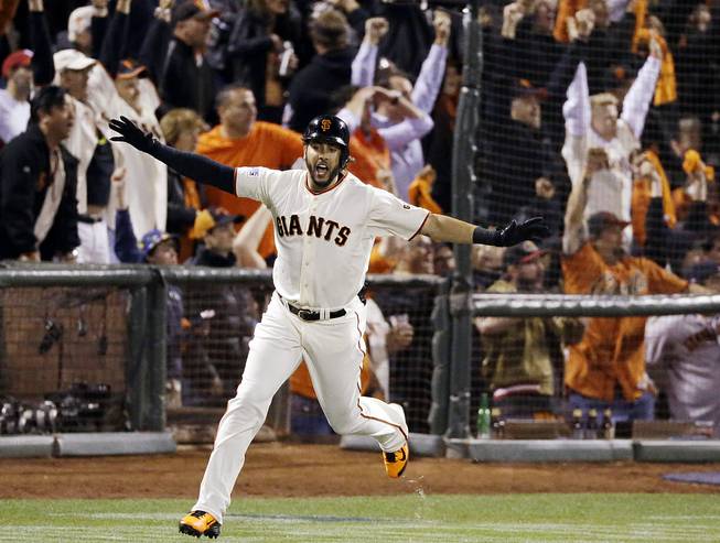 San Francisco Giants' Michael Morse celebrates a home run against the St. Louis Cardinals during the eighth inning of Game 5 of the National League baseball championship series Thursday, Oct. 16, 2014, in San Francisco. 