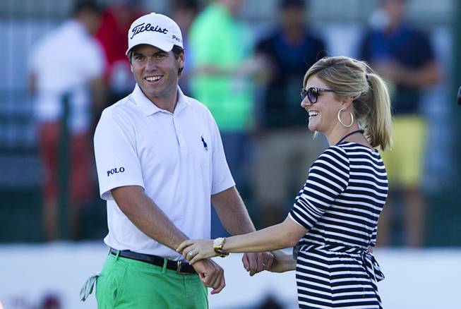 Ben Martin celebrate with his wife Kelly after winning the Shriners Hospitals for Children Open golf tournament at TPC Summerlin Sunday, Oct. 19, 2014, in Las Vegas.