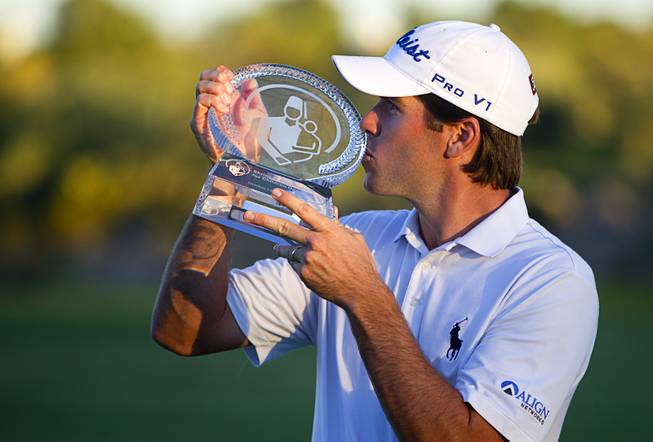 Ben Martin poses with his trophy after winning the Shriners Hospitals for Children Open golf tournament at TPC Summerlin Sunday, Oct. 19, 2014, in Las Vegas.