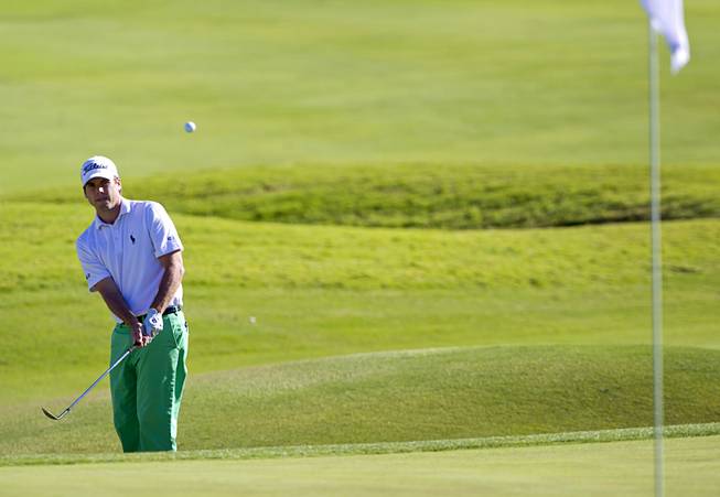 Ben Martin chips onto the ninth green during the Shriners Hospitals for Children Open golf tournament at TPC Summerlin Sunday, Oct. 19, 2014.