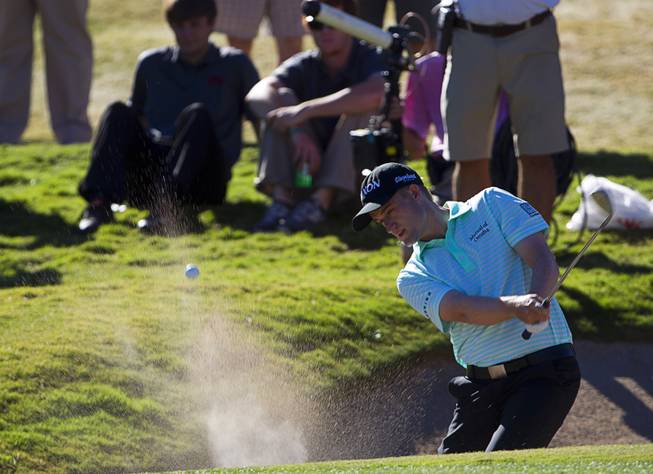 Russell Knox hits out of bunker onto the ninth green during the Shriners Hospitals for Children Open golf tournament at TPC Summerlin Sunday, Oct. 19, 2014.