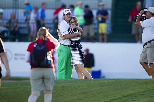 Ben Martin celebrates with his wife Kelly after winning the Shriners Hospitals for Children Open golf tournament at TPC Summerlin Sunday, Oct. 19, 2014.