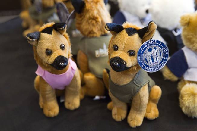 Police dog plush toys by Hero Industries are displayed in a vendor area during the 24th Annual Las Vegas Police K9 Trials at the Orleans Arena Sunday, Oct. 19, 2014.