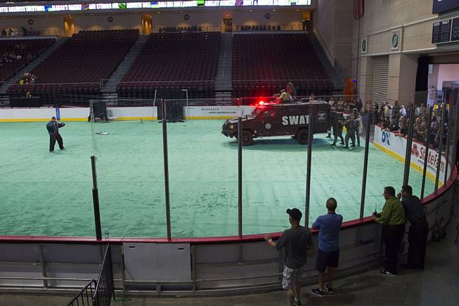 A Metro SWAT officers perform in a half-time show during the 24th Annual Las Vegas Police K9 Trials at the Orleans Arena Sunday, Oct. 19, 2014.
