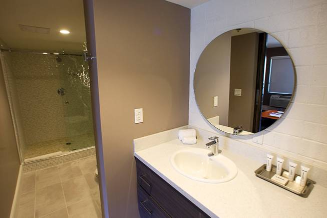 A bathroom is shown in the Ultimate Crash Pad suite in  Oasis at Gold Spike in downtown Las Vegas Tuesday, Oct. 21, 2014. The Oasis, a boutique hotel owned and operated by the Downtown Project, officially unveiled renovations during a tour Tuesday. The suite was created by combining two of the older hotel rooms.