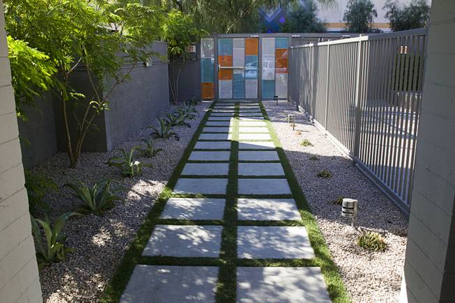 A walkway leads to Ogden Avenue at Oasis at Gold Spike in downtown Las Vegas Tuesday, Oct. 21, 2014. The Oasis, a boutique hotel owned and operated by the Downtown Project, officially unveiled renovations during a tour Tuesday.