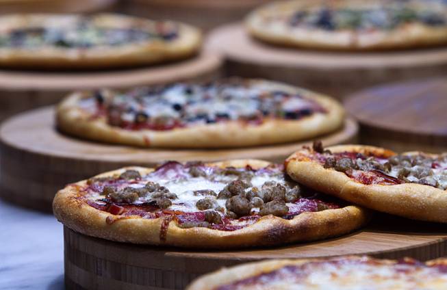 Pizzas are displayed at the new Fulton Street Food Hall at Harrahs Las Vegas Wednesday, Oct. 22, 2014.