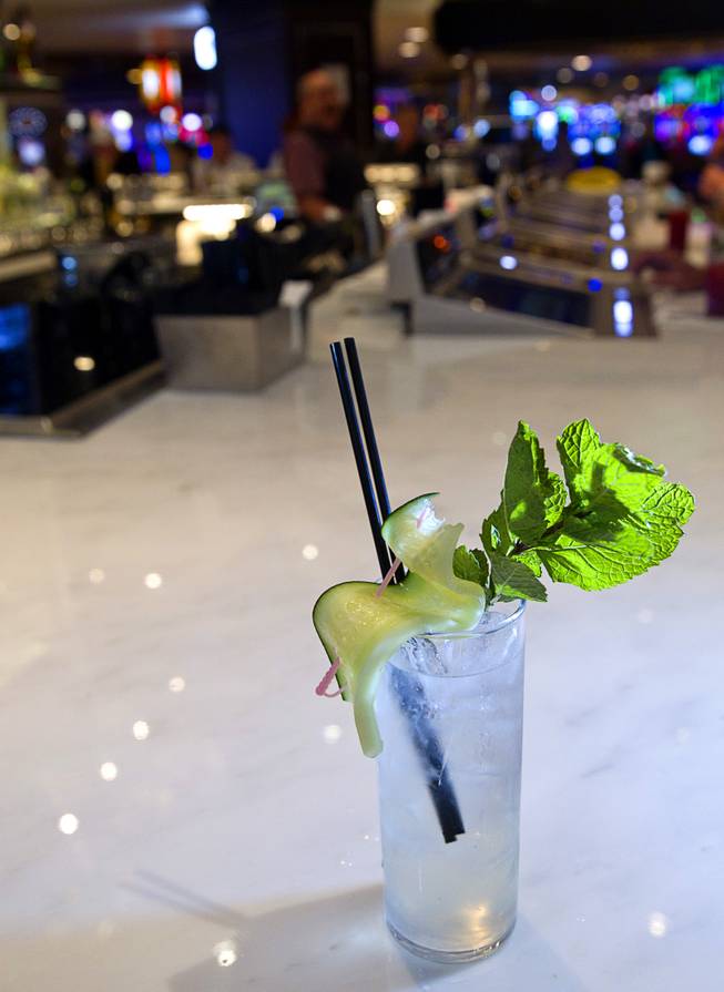 A Cucumber Cup cocktail is shown at the bar in the new Fulton Street Food Hall at Harrahs Las Vegas Wednesday, Oct. 22, 2014. The cocktail is made with Hendrick's gin, Robinsons ginger ale and garnished with fresh mint and cucumber.