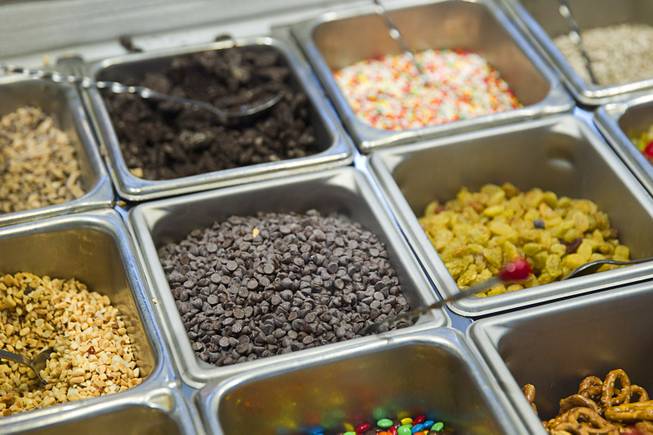 Toppings are shown at a frozen yogurt station at the new Fulton Street Food Hall at Harrahs Las Vegas Wednesday, Oct. 22, 2014.