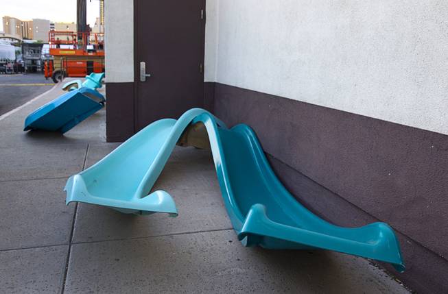 Water slides are shown by the side of the Western Hotel in downtown Las Vegas Wednesday, Oct. 22, 2014. The slides will be part of an art installation by Eric Tillinghast during the Life is Beautiful festival. 