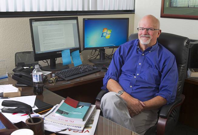 Edward Coulson, director of Lied Institute for Real Estate Studies and professor of economics, poses in his office at UNLV Wednesday, Oct. 22, 2014.