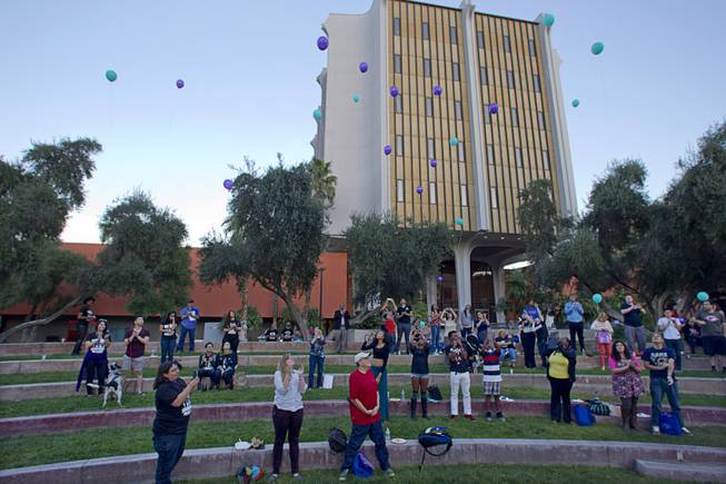 People release balloons during the 21st Annual Take Back the Night rally at UNLV Thursday, Oct. 23, 2014.