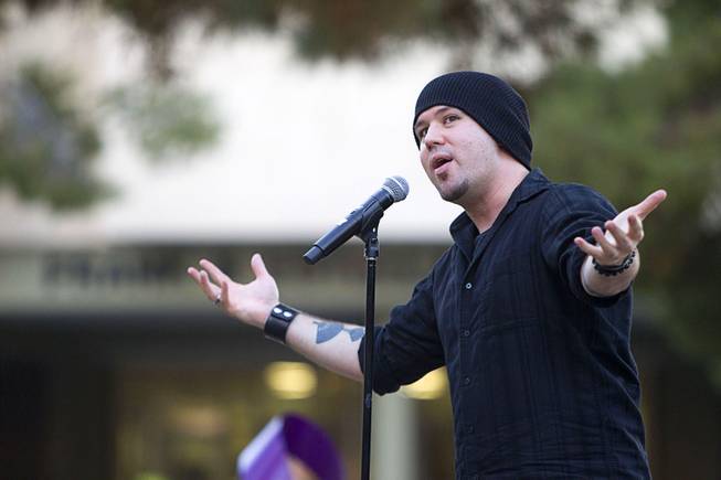 Guante, right, a hip hop artist and two-time National Poetry Slam  Champion, performs during the 21st Annual Take Back the Night rally at UNLV Thursday, Oct. 23, 2014. Guante came from Minneapolis for the event, he said.