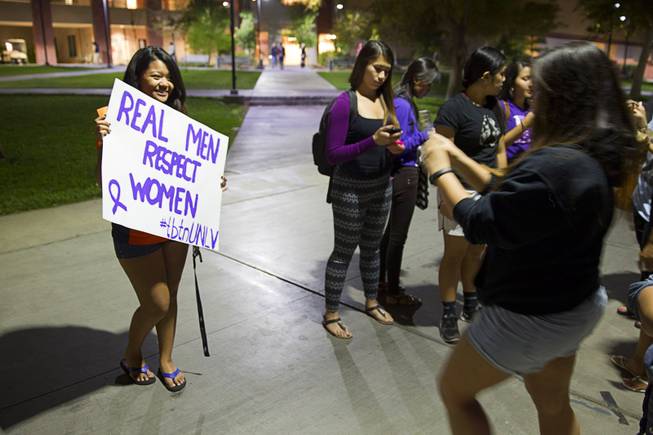 UNLV student Chrissy Jimeno poses with a sign during the 21st Annual Take Back the Night rally at UNLV Thursday, Oct. 23, 2014.