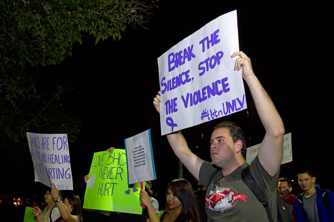 UNLV student Justin Singletary marches during the 21st Annual Take Back the Night rally at UNLV Thursday, Oct. 23, 2014.
