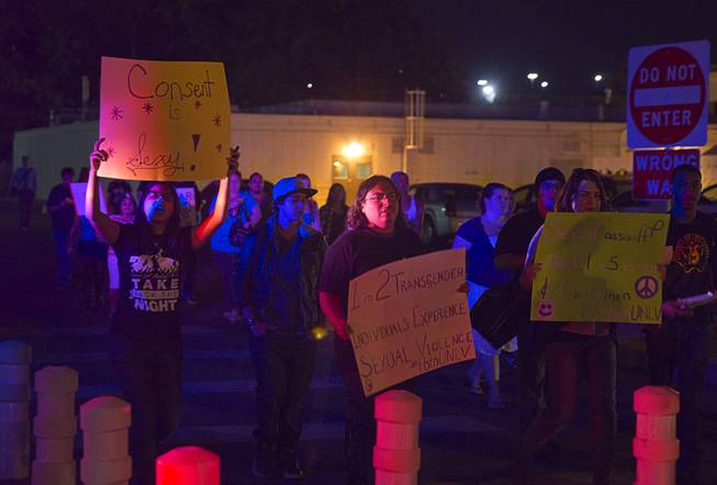 People march through campus during the 21st Annual Take Back the Night rally at UNLV Thursday, Oct. 23, 2014.